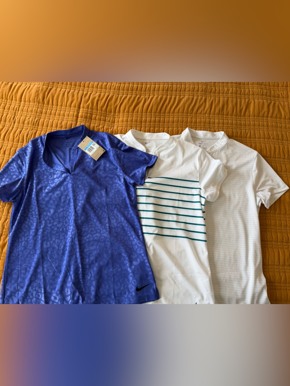 Three Women’s Nike Golf Polos